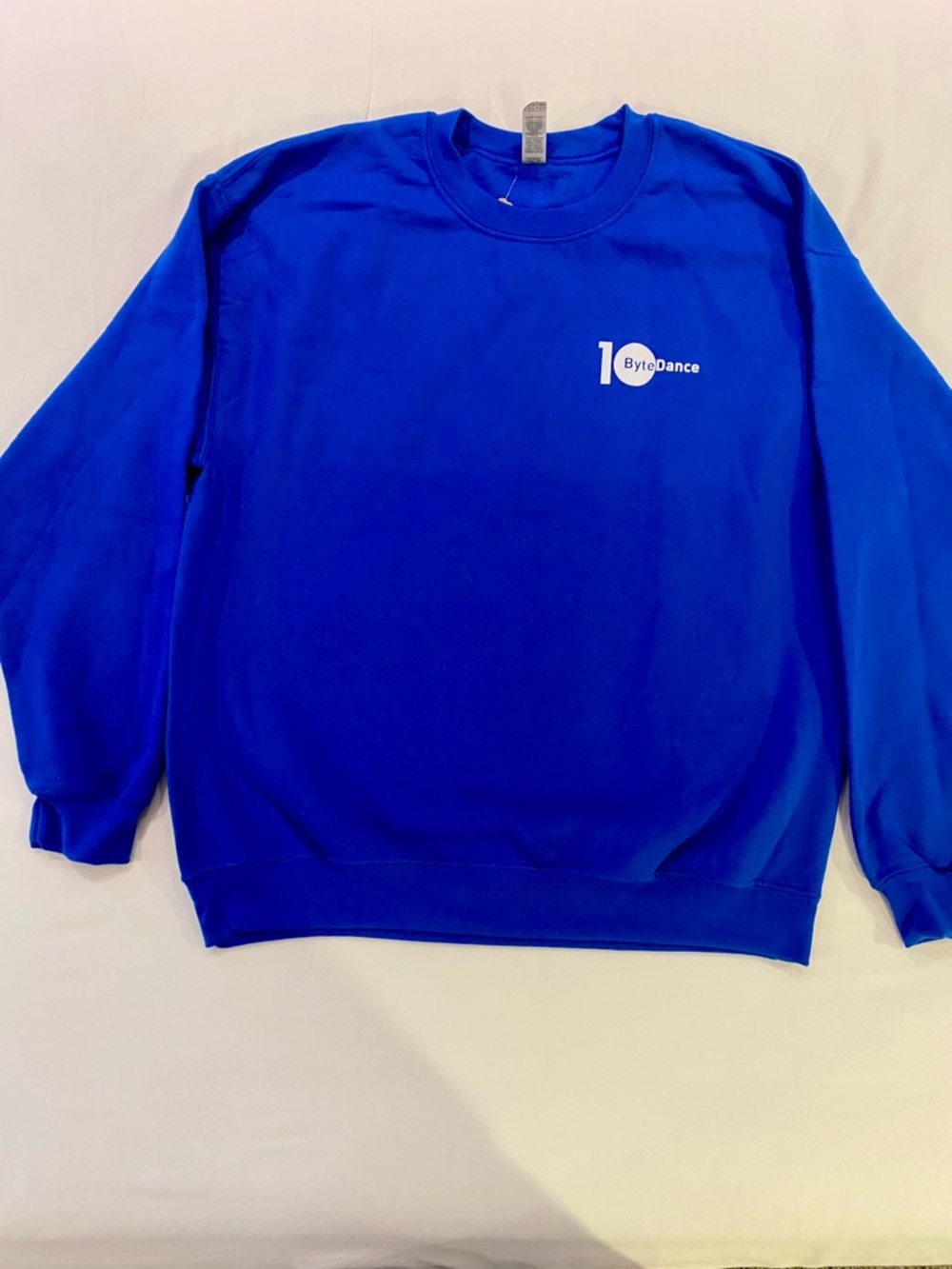 Gildan Heavy Blend Men’s sweatshirt in‎ Bright Blue with White Byte Dance logo